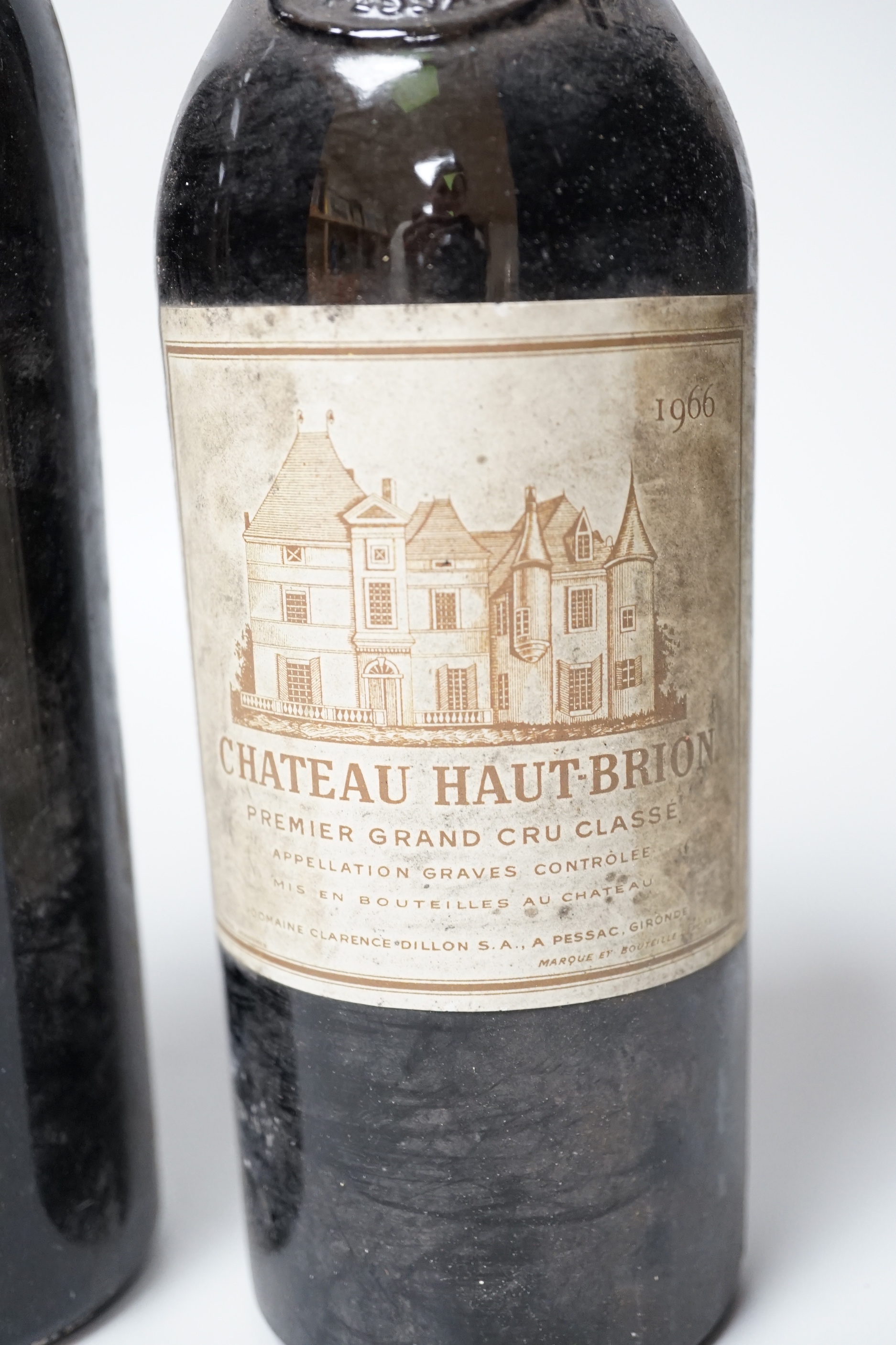 Four bottles of wine including one Chateau Haut-Brion, 1966 and three others including Rauzan-Segla, Margaux.